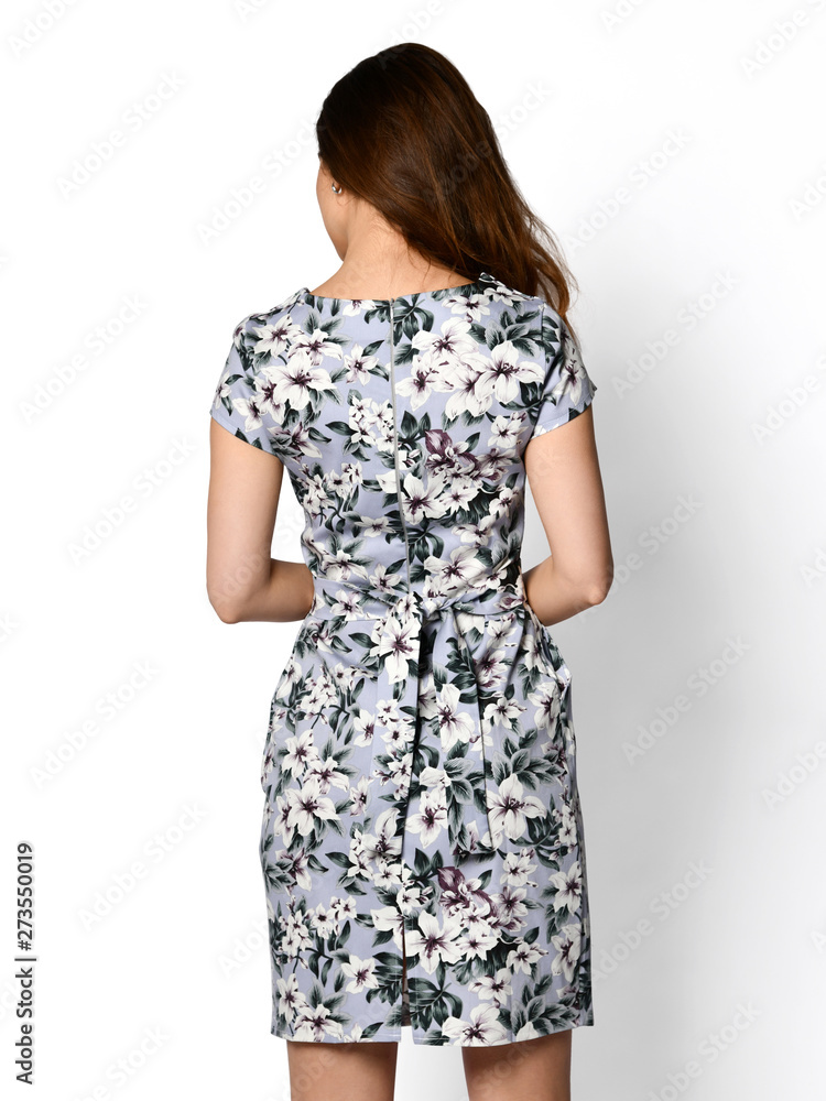 Young beautiful woman walking in new design casual summer long dress full body on white backside view Young beautiful woman walking in new design casual summer long dress full body on white backside view