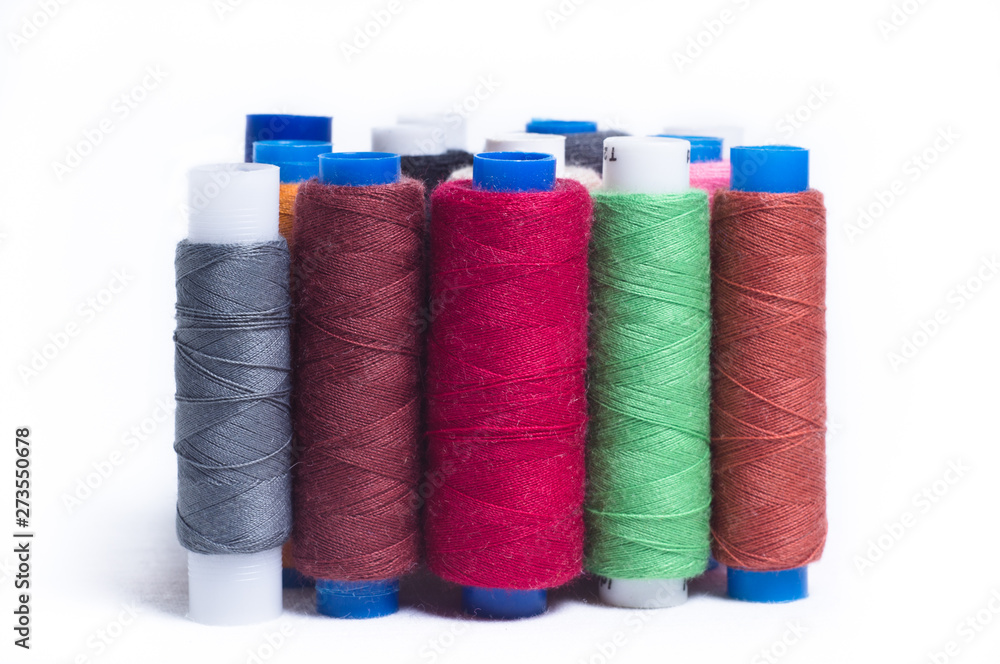 Spools of thread standing vertically on white background Spools of thread standing vertically on white background