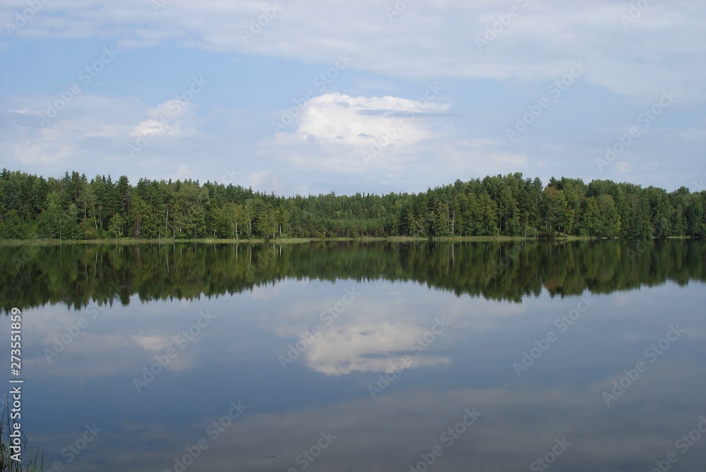 reflection of clouds on the smooth surface of the lake