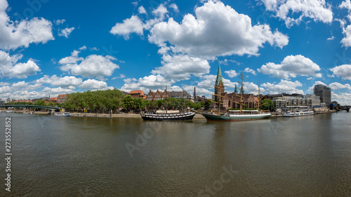 Bremen, Germany. View of the river Weser with historic ships and promenade.