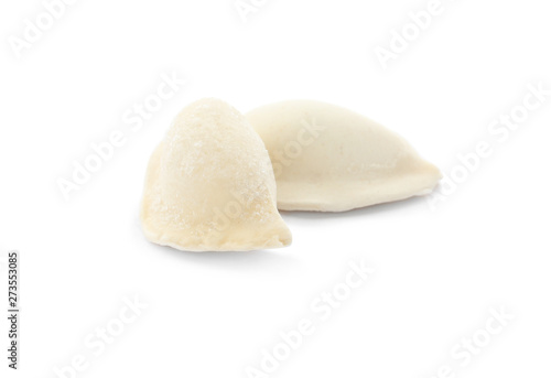 Raw dumplings with tasty filling on white background