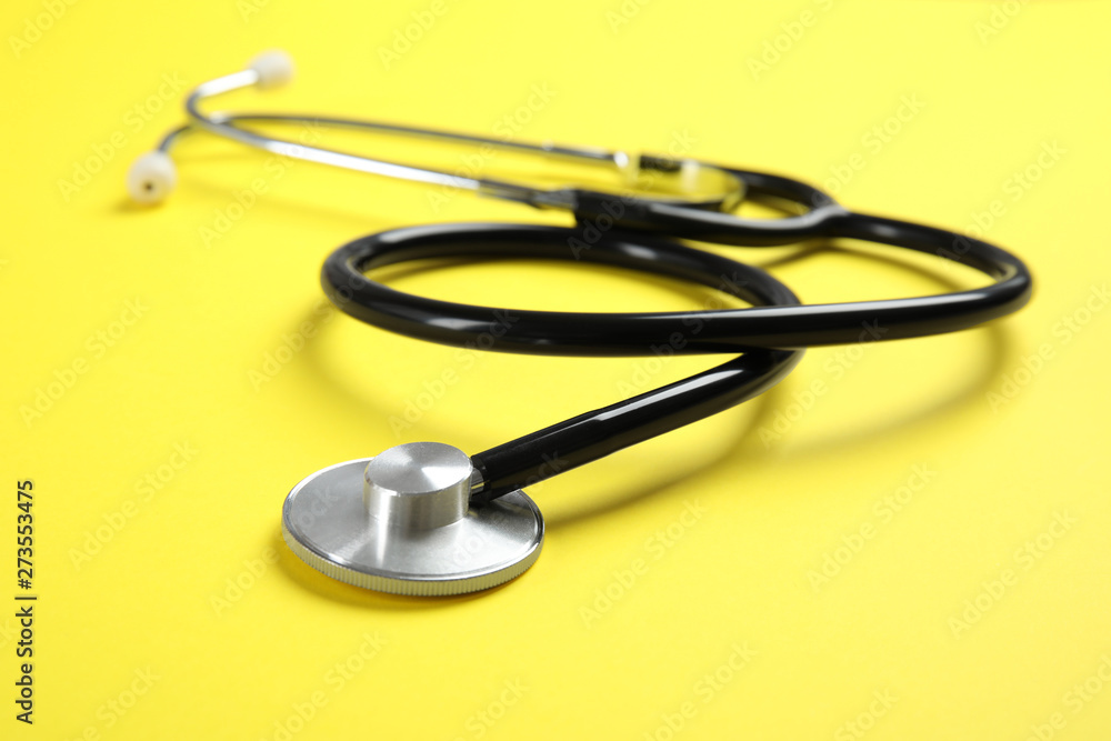 Stethoscope on color background, closeup. Medical tool Stethoscope on color background, closeup. Medical tool