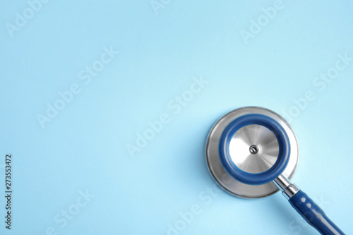 Wallpaper Mural Stethoscope with space for text on color background, top view. Medical tool Torontodigital.ca