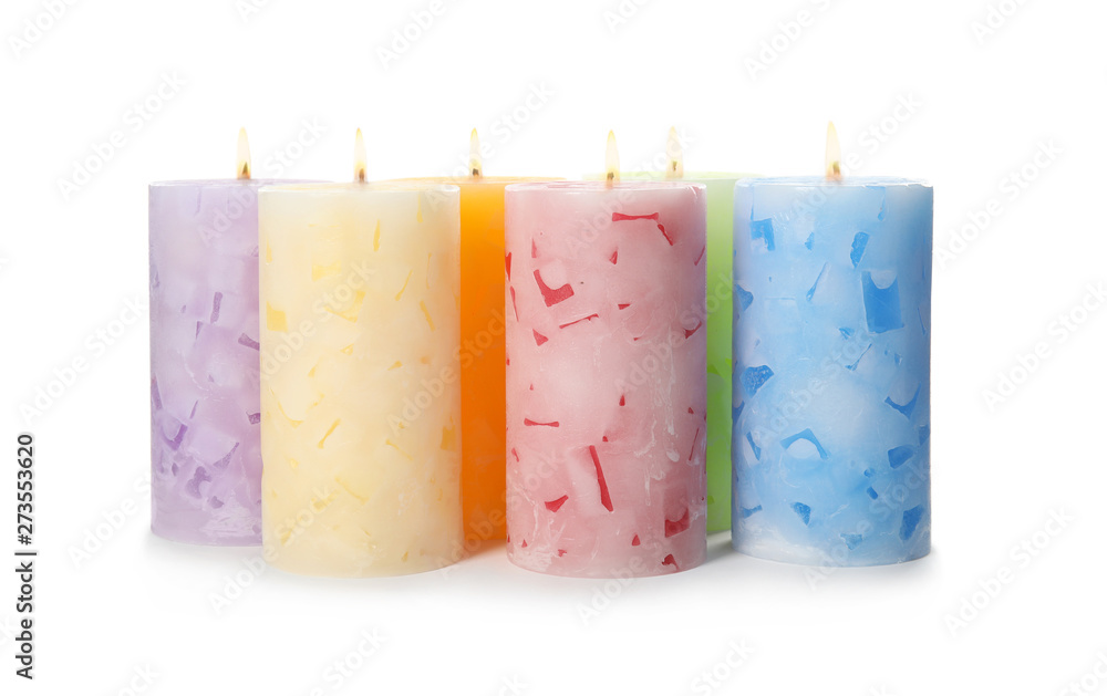 Alight color wax candles on white background - obrazy, fototapety, plakaty 