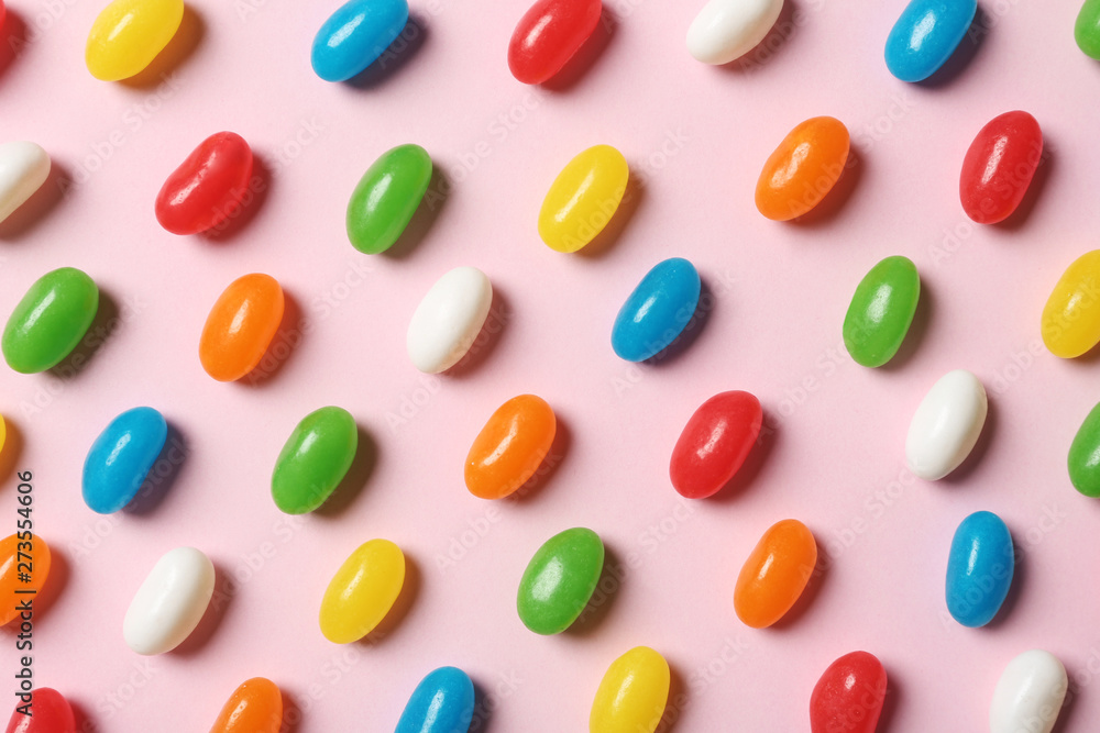 Bright jelly candies on color background, flat lay Bright jelly candies on color background, flat lay