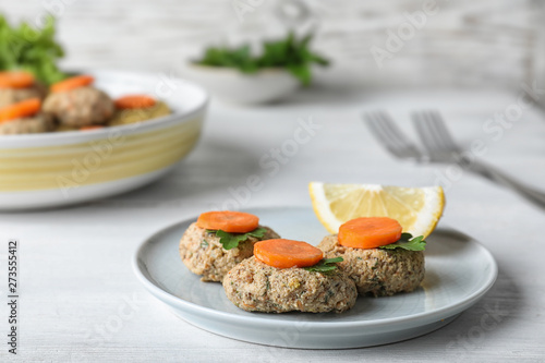 Plate of traditional Passover (Pesach) gefilte fish on table