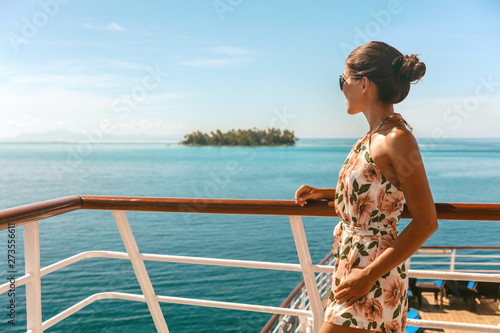 Stampa su tela Cruise ship travel vacation luxury tourism woman looking at ocean from deck of sailing boat