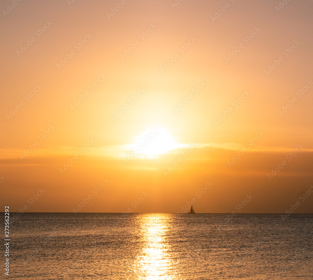 Ocean sunset sailboat
