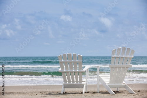 Photography Empty white wooden chairs at a paradisiac beach on the tropics in a beautiful su