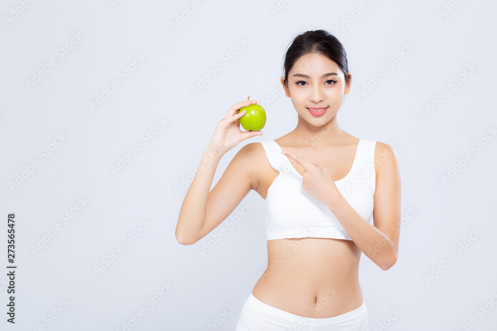 Portrait asian woman smiling holding green apple fruit and beautiful body diet with fit isolated on white background, girl loss weight slim with cellulite or calories, health and wellness concept. Portrait asian woman smiling holding green apple fruit and beautiful body diet with fit isolated on white background, girl loss weight slim with cellulite or calories, health and wellness concept.