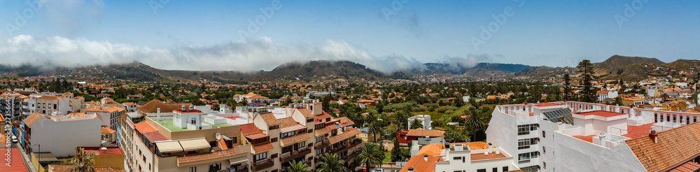 Aerial view of the historic town of San Cristobal de La Laguna in Tenerife showing the buildings and streets with mountains in the background