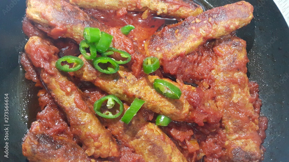 Delicious spicy home made fried kebab with green pepper Delicious spicy home made fried kebab with green pepper