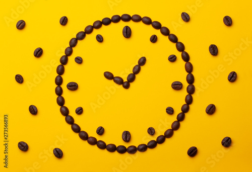 Coffee beans on an orange background.