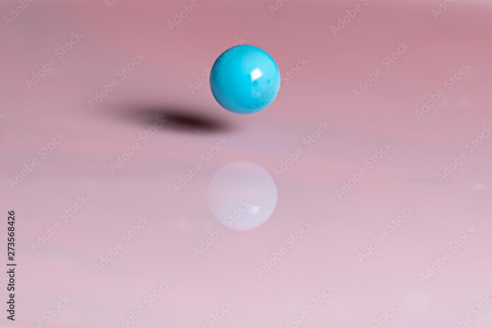 Splash of milk droplets in close up macro high resolution isolated against a black background Splash of milk droplets in close up macro high resolution isolated against a black background