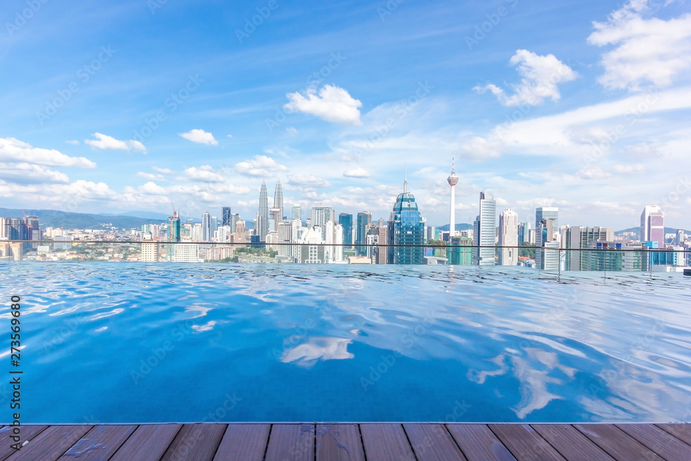 Fototapeta premium Swimming pool on roof top with beautiful city view Kuala lumpur, Malaysia