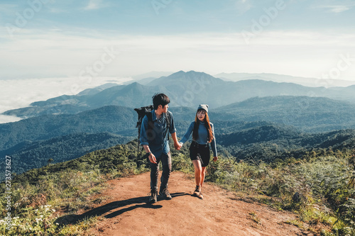 Adventures Couple trail hiking in the forest