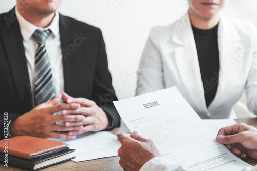 Senior manager HR reading a resume during a job interview employee young man meeting Applicant and recruitment