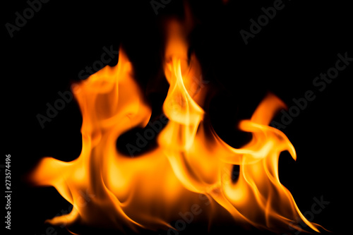 The flame is burning on a black background - image