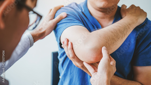 Photography Physical Doctor consulting with patient About elbow muscule pain problems Physic