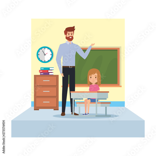 male teacher and girl seated in desk in classroom