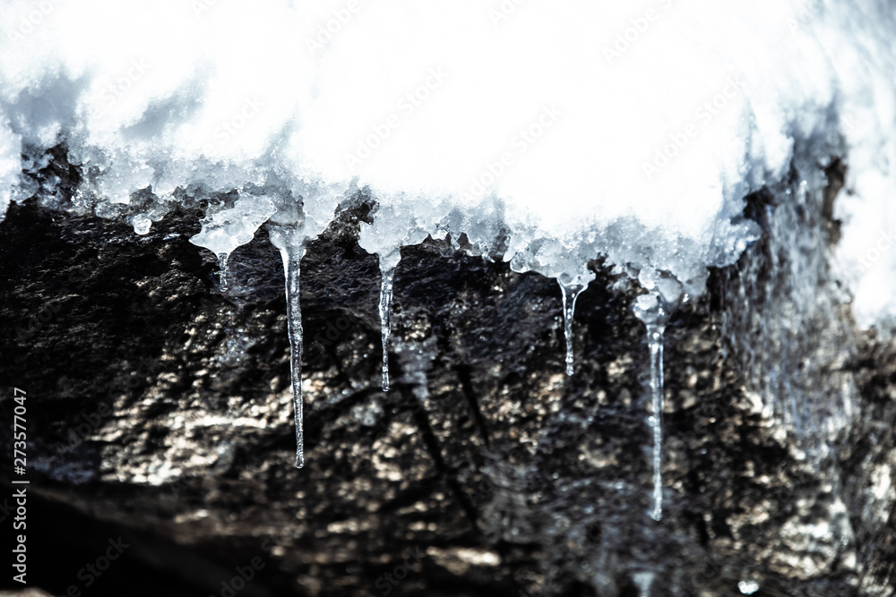 Icicles, frozen water icicles close up winter nature background, cold weather snowy season Icicles, frozen water icicles close up winter nature background, cold weather snowy season