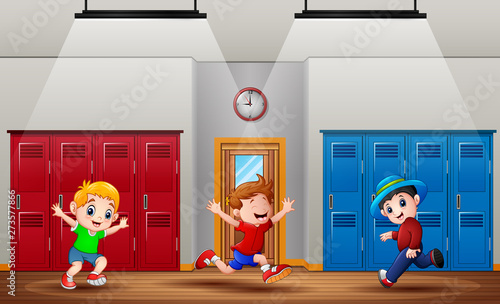 Happy boys running at school hallway