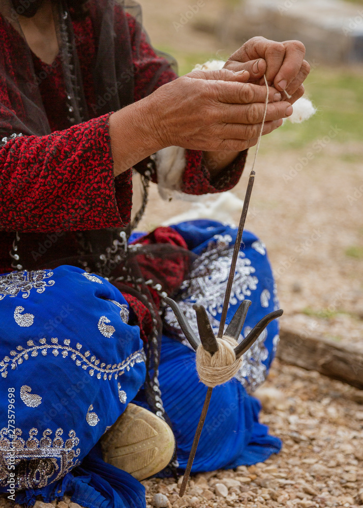 Iranian Hill Tribe Woman Spins Goat Wool - Close-up.
