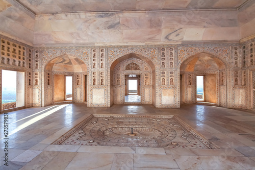 Agra Fort white marble architecture with intricate wall artwork carvings of Musamman Burj. Agra fort has been designated as a UNESCO world heritage site