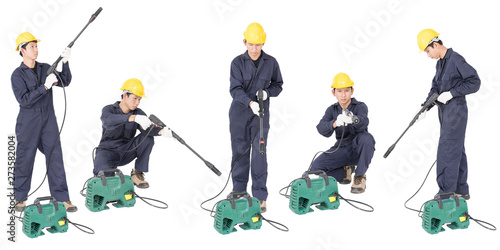 Set of Young man stand and holding high pressure water gun photo