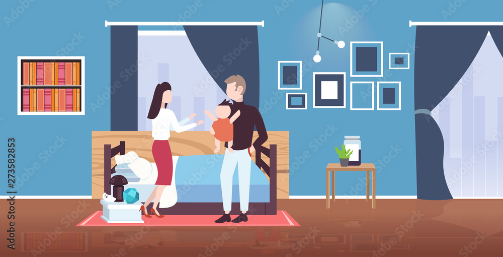 father mother and newborn baby having fun together happy family parenthood concept man woman playing with newborn child modern bedroom interior flat full length horizontal father mother and newborn baby having fun together happy family parenthood concept man woman playing with newborn child modern bedroom interior flat full length horizontal