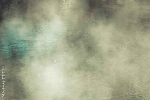 Background image of steam rising above a hot water thermal pool © MollyNZ
