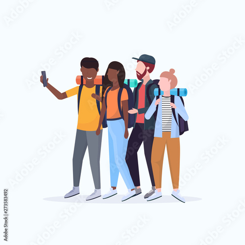 group tourists hikers with backpacks taking selfie photo on smartphone camera hiking concept mix race travelers on hike full length white background flat