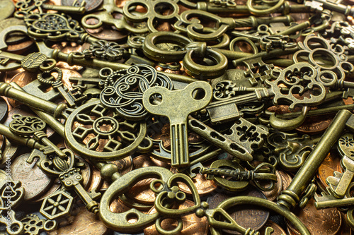 Old vintage keys gold texture on copper coin abstract background.