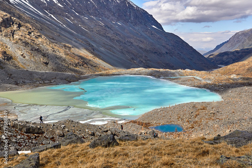Mountain lake with turquoise water stream landscape, Fann, Pamir Alay, Tajikistan photo