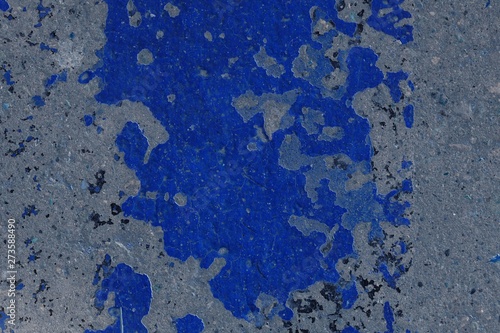 Toned asphalt surface with paint on it close up. Abstract background © Talulla