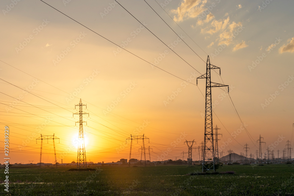 Fototapeta premium Sunset Landscape of High-voltage power lines in the land around city of Plovdiv, Bulgaria