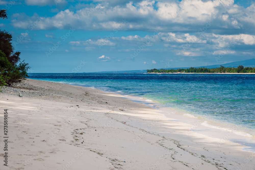 Tropical beach and blue ocean in paradise island