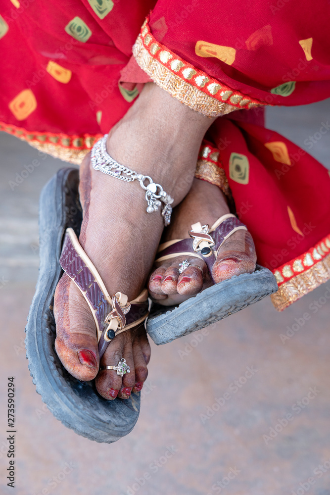 Indian Woman Legs Decorated With Rings And Bracelets In Rajasthan 