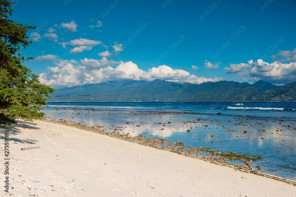 Tropical beach and blue ocean in paradise island