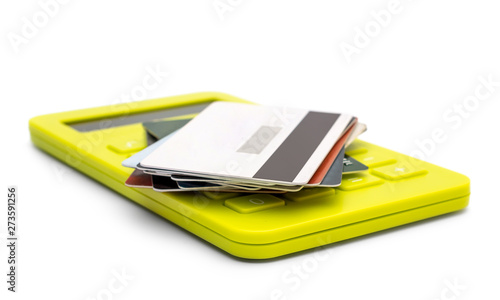 Wallpaper Mural Stack of credit cards on calculator. Isolated on white. Business concept. Torontodigital.ca