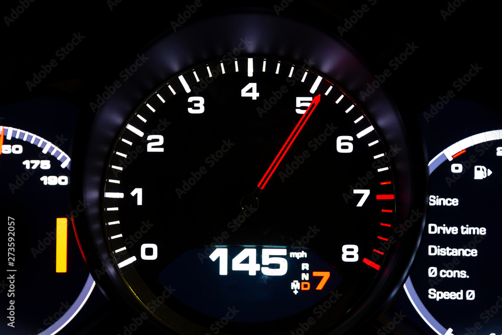 Modern light car mileage on black background Modern light car mileage on black background