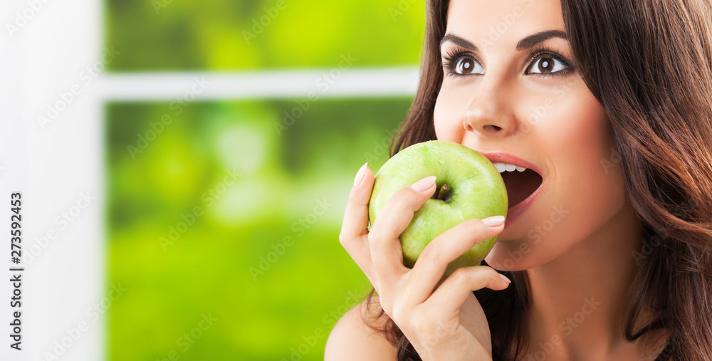 Portrait picture of smiling woman with green apple Portrait picture of smiling woman with green apple