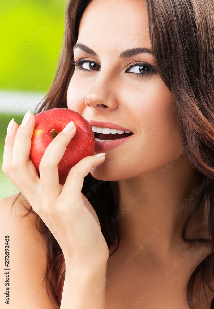 Portrait picture of smiling woman with red apple Portrait picture of smiling woman with red apple