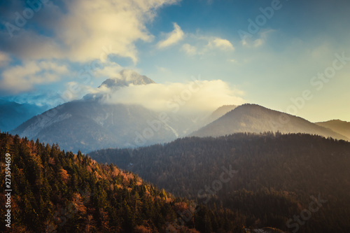 Cloudy view of the mountains in the European Alps in Austria in autumn colors, nature background concept