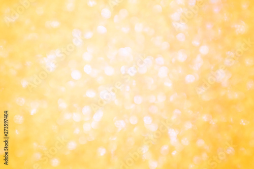 Blurred background - golden sparkles. Abstract image. Bright color. Abstract circular bokeh.