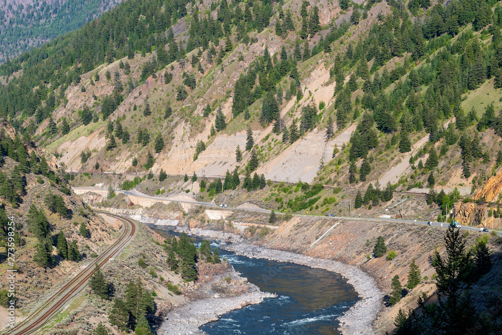 Railroad tracks and the Trans-Canada highway in the Thompson River Valley, British Columbia, Canada