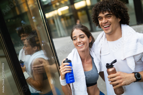 Couple jogging and running outdoors in city photo