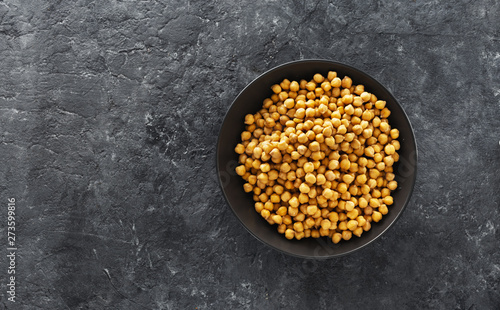 Cooking chickpeas bowl dark stone background top view