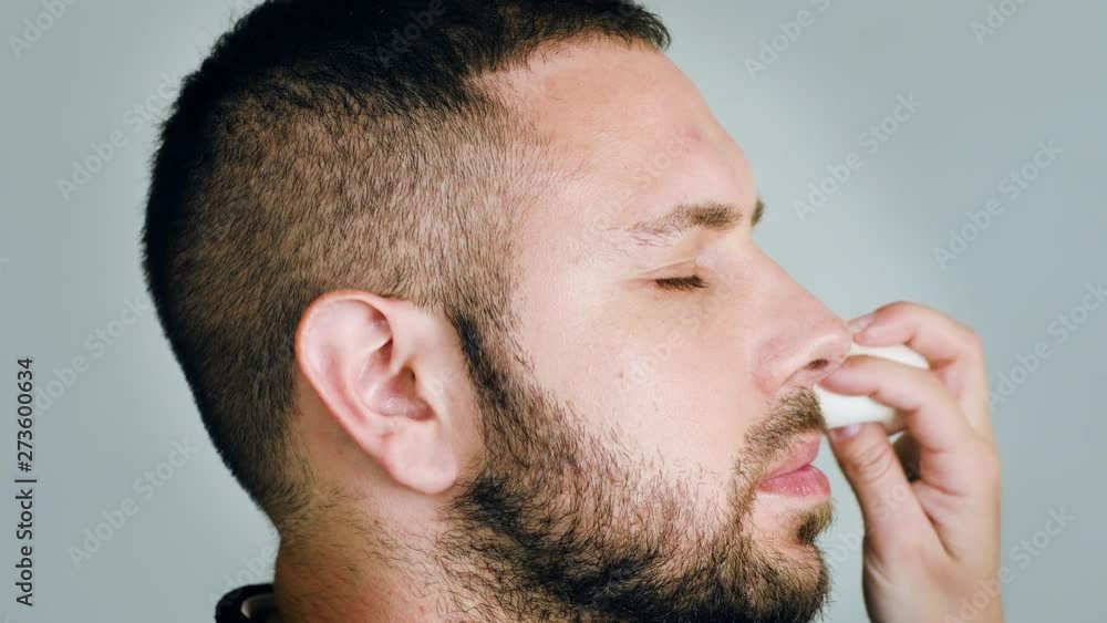 Bearded man actor with eyes closed while getting makeup Bearded man actor with eyes closed while getting makeup