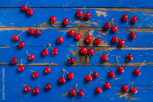 Antique wooden surface with appetizing cherries